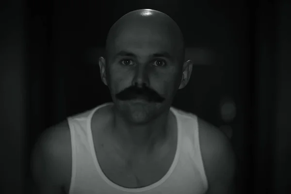 unusual portrait of a bald mustachioed young gentleman, eccentric mister, psychology concept