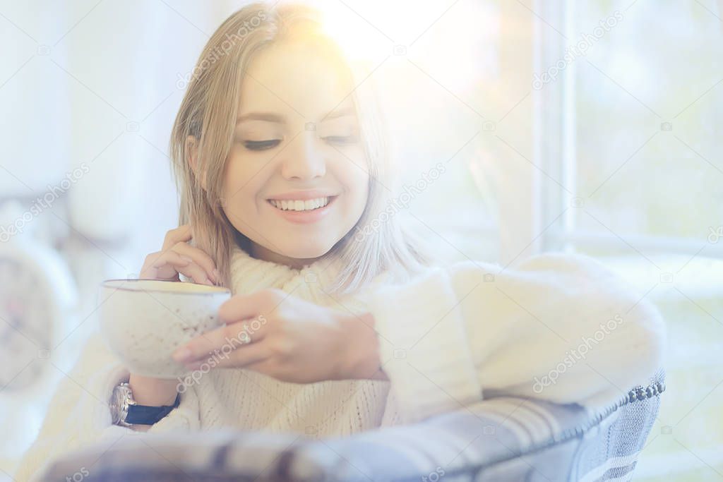 young model drinks tea in a cafe, vacation concept table setting