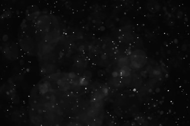 Kar siyah arkaplan soyut dokusu, gökyüzüne düşen kar taneleri