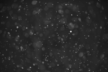 Kar siyah arkaplan soyut dokusu, gökyüzüne düşen kar taneleri
