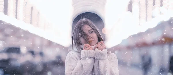 snowfall woman city christmas outside, city portrait in snowfall, young model posing in festive look