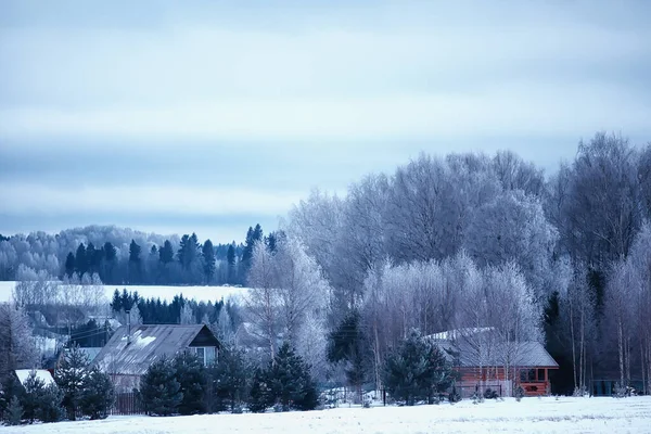 Russian village in winter, landscape in January snowfall, village houses