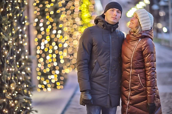 lovers couple new year street walking at winter night in the city