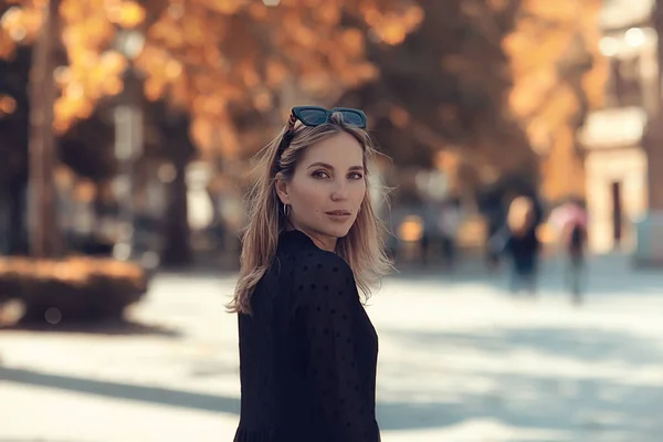 happy woman in autumn look, young girl outside in autumn mood