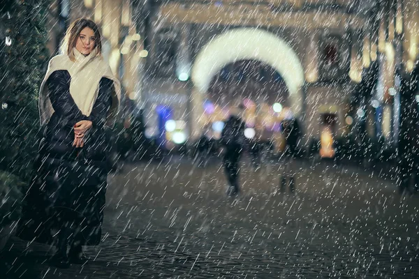 christmas rain woman, young girl model in coat outside on christmas night