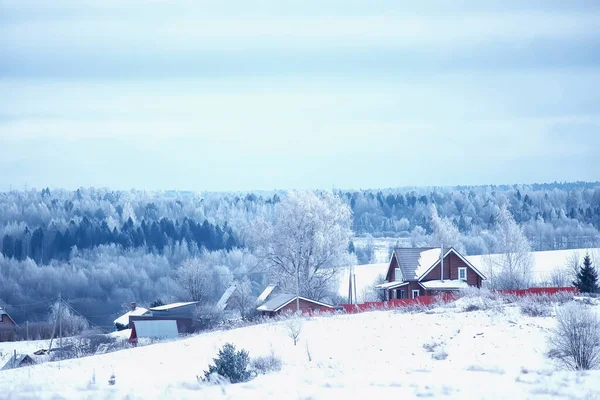 Russian village in winter, landscape in January snowfall, village houses