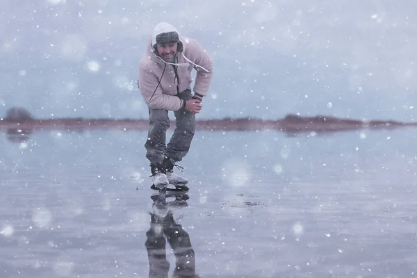 one guy skates on the ice of a frozen lake, nature landscape, man outdoor sports