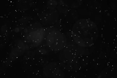 Kar siyah arkaplan soyut dokusu, gökyüzüne düşen kar taneleri