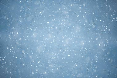 mavi kar yağışı bokeh arkaplanı, soyut kar tanesi arkaplanı bulanık mavi