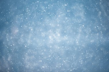 mavi kar yağışı bokeh arkaplanı, soyut kar tanesi arkaplanı bulanık mavi