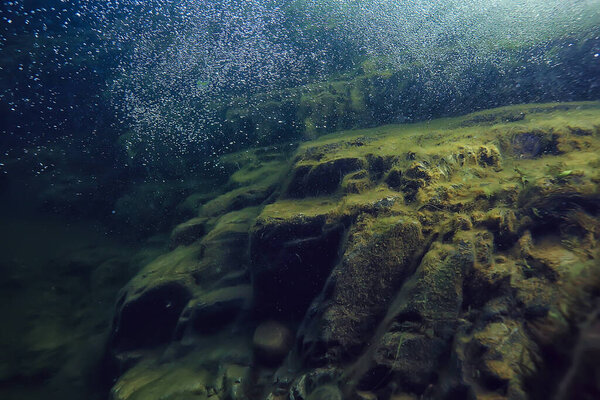 камни на дне подводного ландшафта, абстрактные размытые под водой
