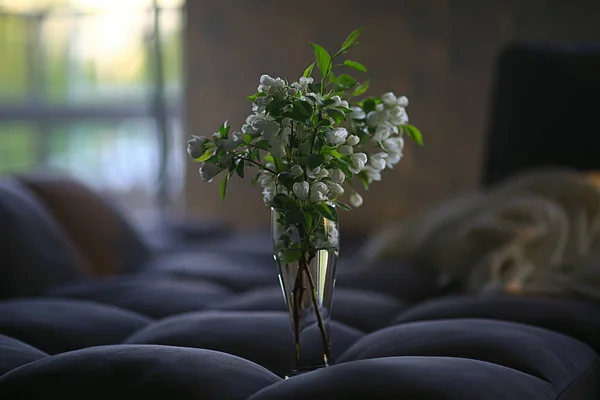 bouquet flowers of apple tree branches in a vase, a beautiful bouquet in the spring loft interior