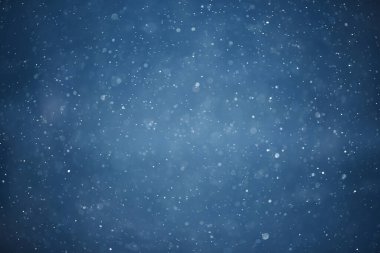 mavi kar yağışı bokeh arkaplanı, soyut kar tanesi arkaplanı bulanık mavi