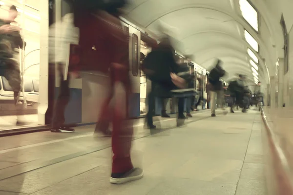 crowd of people metro in motion blurred, abstract background urban traffic people