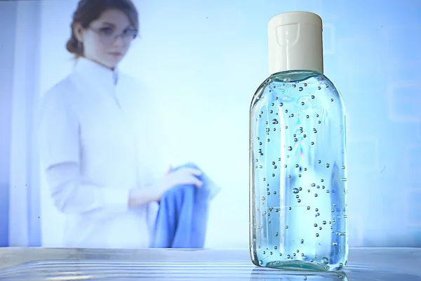 female doctor disinfects hands with antiseptic, doctor\'s hands clean gloves antiseptic, virus protection conronavirus