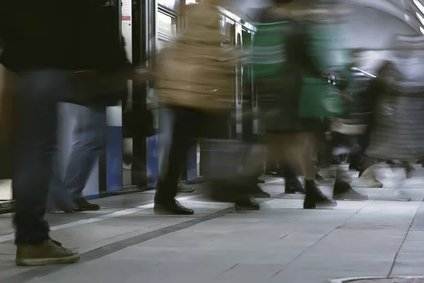 crowd of people metro in motion blurred, abstract background urban traffic people