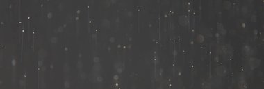 soyut arkaplan, siyah üzerine beyaz bokeh düşen kar sisi görünümünü örtüyor