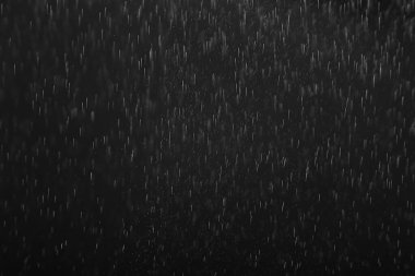 Siyah yağmurun örtülmesi için arka plan, soyut stüdyo su damlalarını düşürür