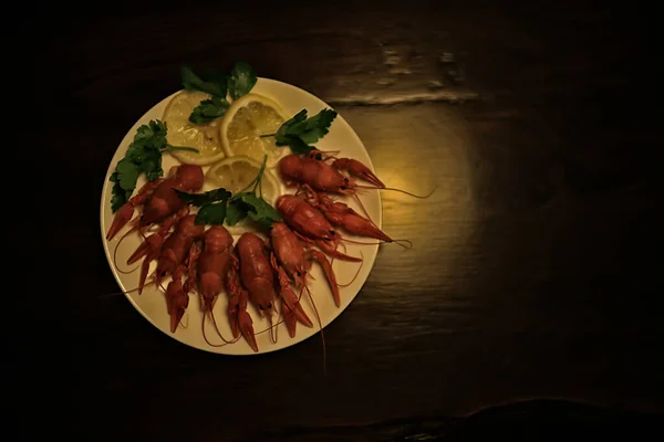 boiled crayfish in a plate, red river arthropods, delicacy food diet seafood