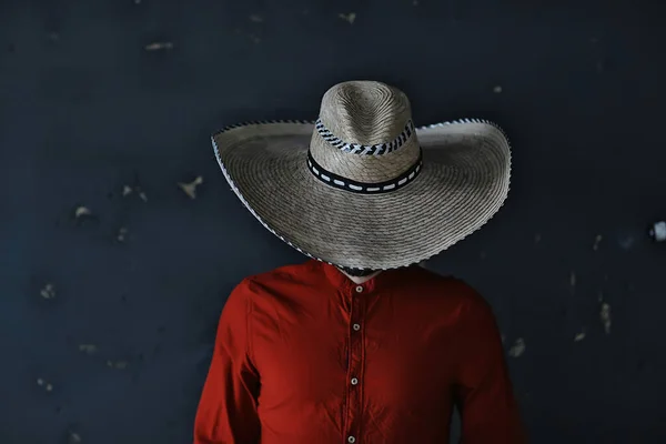 stern cowboy in a hat with brim, straw, retro vintage style, angry man wild west western