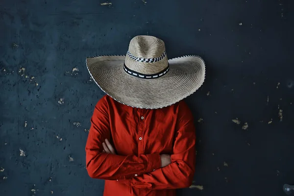 stern cowboy in a hat with brim, straw, retro vintage style, angry man wild west western