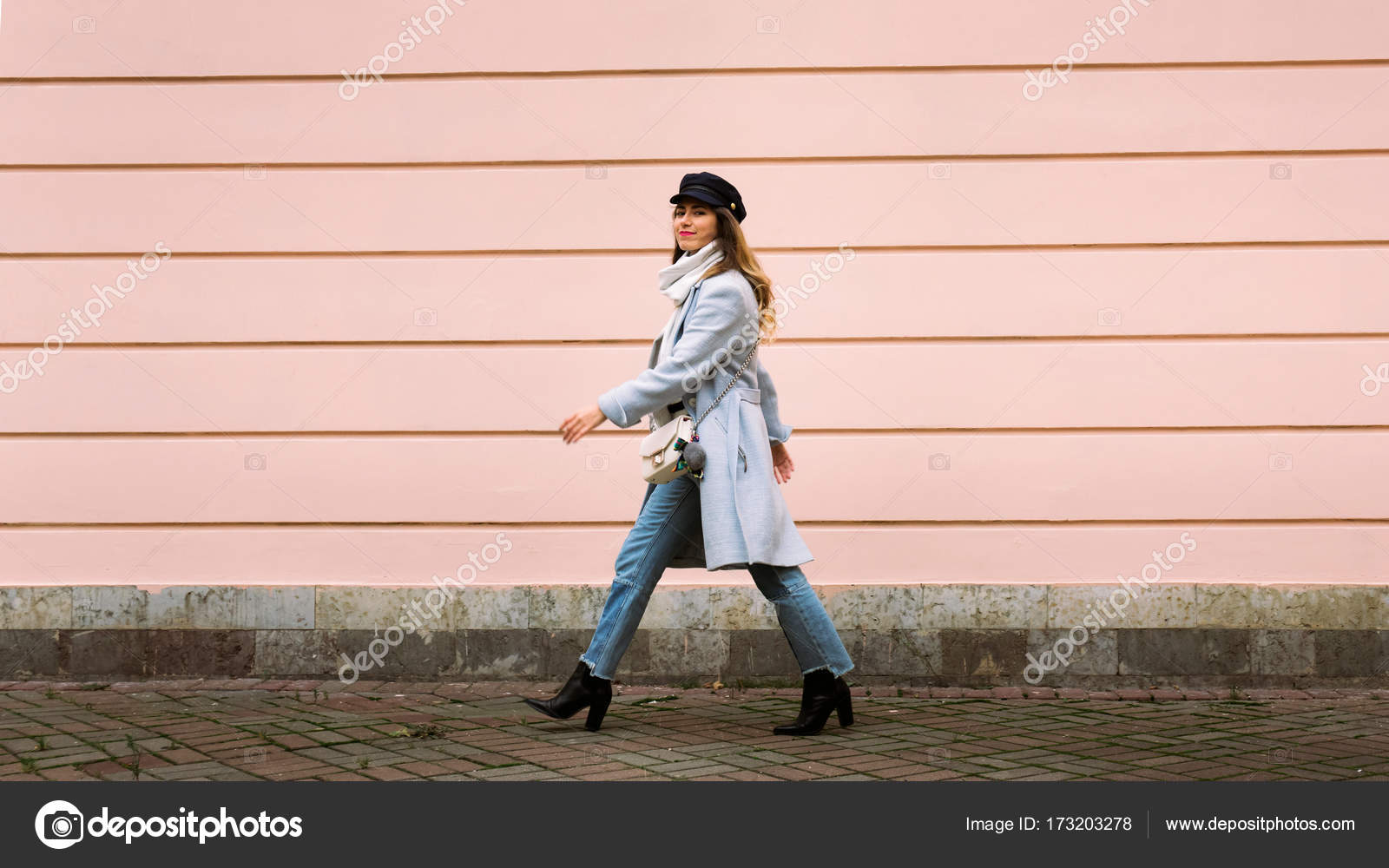 Outdoor fullbody portrait of young beautiful fashionable woman