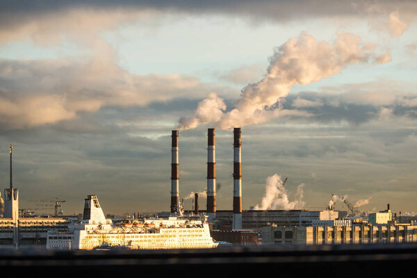 Energy. Smoke from chimney of power plant or station. Industrial landscape at day