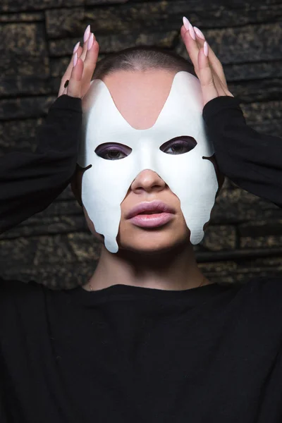 Shaved young model in mask