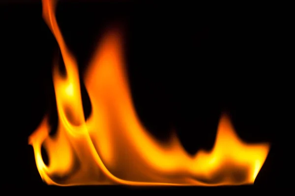 Blaze of fire isolated on black ground — Stock Photo, Image
