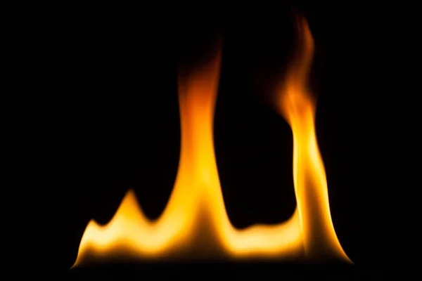 Blaze of fire isolated on black ground — Stock Photo, Image