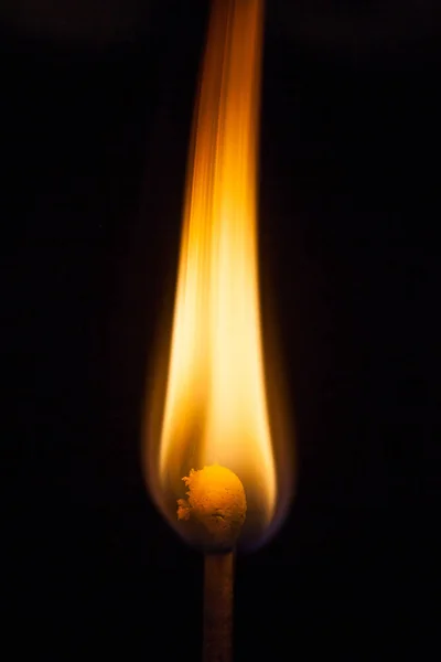 Match and blaze of fire on match isolated on black background — Stock Photo, Image