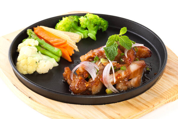 pork neck grill isolated on black plate on white background (Tha