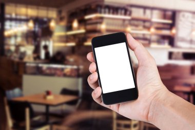 Smartphone beyaz ekran sahibi el ile bulanık kullanan kişi 