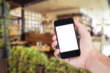 Smartphone beyaz ekran sahibi el ile bulanık kullanan kişi 