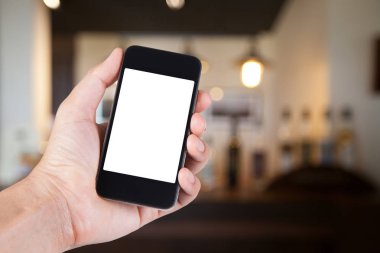 Smartphone beyaz ekran sahibi el ile bulanık kullanan kişi 