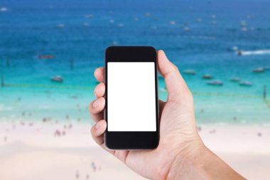 Smartphone beyaz ekran sahibi el ile bulanık kullanan kişi 