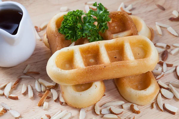 Close-up waffles with nut on wood plate for breakfast. — Stock Photo, Image