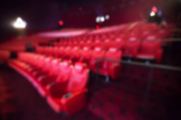 Fundo borrado de assento vermelho no cinema . — Fotografia de Stock