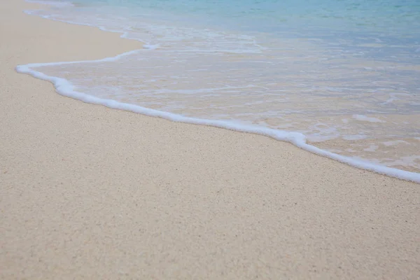 Abstract background of sandy beach with soft waves. — Stock Photo, Image