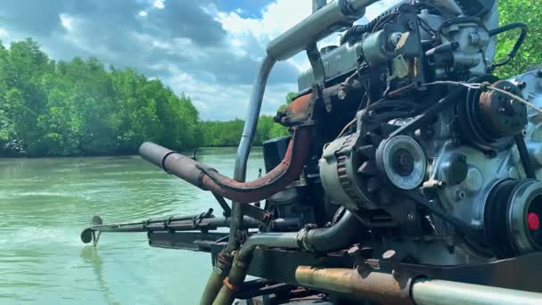 Closeup view of motor of boat moving along river on tropical island. — Stock Video