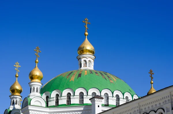 Orthodox Christian monastery, Pechersk Lavra in Kiev on green hi Stock Picture