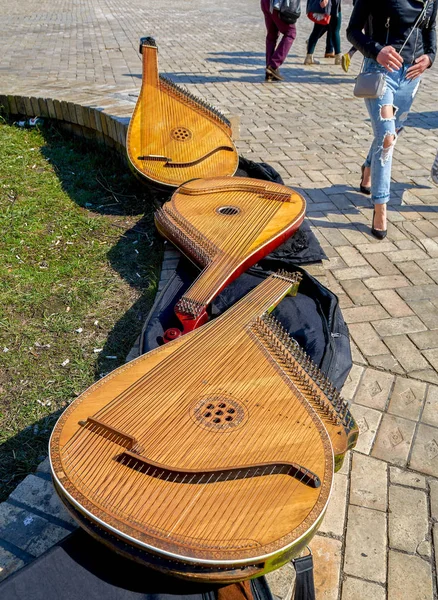 Three bandura (pandora) on the bench — Stock Photo, Image