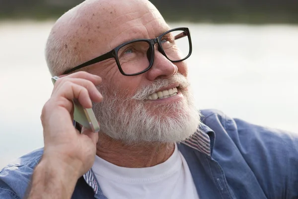 older man using a smartphone