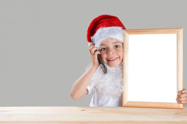 Young Santa Talking Phone Smiling Looking Camera Sitting Wooden Table — Stock Photo, Image
