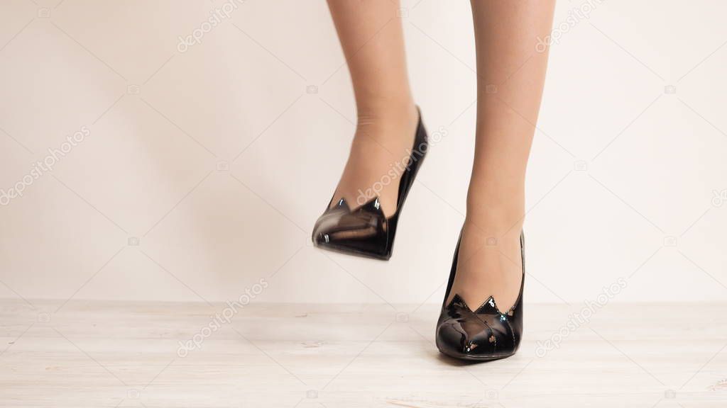 Young woman wearing high heel shoes