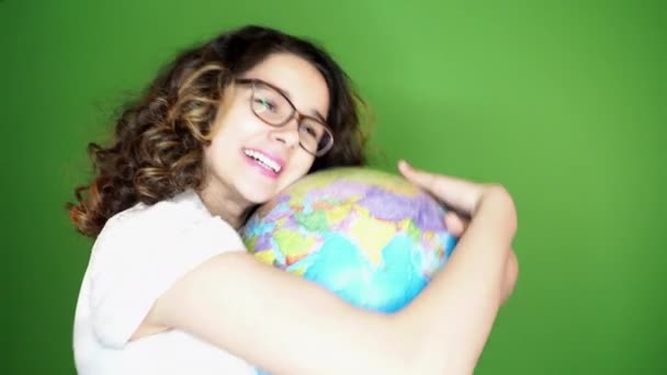 Beautiful Young Girl Globe Green Background — Stock Video