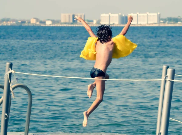 Little Boy Jumping Wooden Pier Sea Water — Stock Photo, Image
