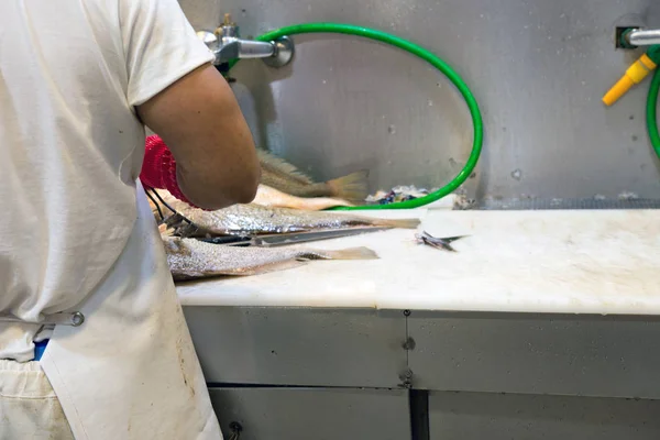 Midsection Man Cleaning Fish Table Market — 스톡 사진