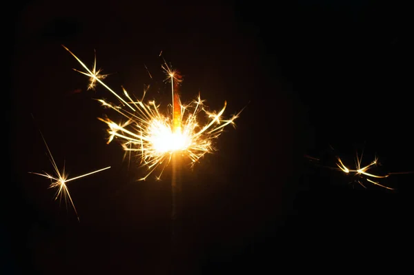 Lit Sparklers Contra Fondo Negro —  Fotos de Stock