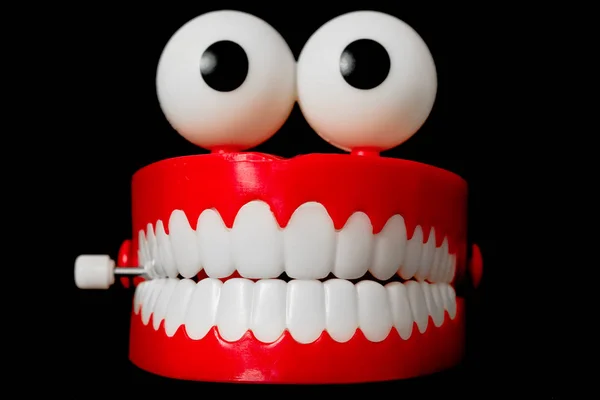 Tjattrande tänder leksak från framsidan Stockbild